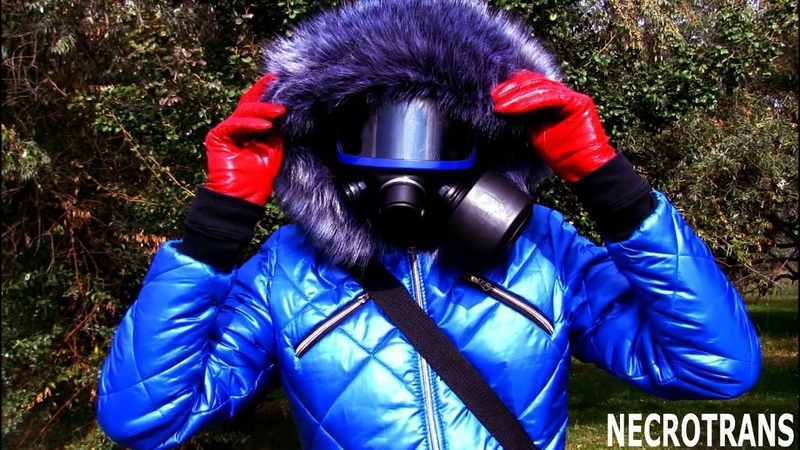 Blue ski suit with hood; red leather gloves, various modern gas masks, a voluminous down