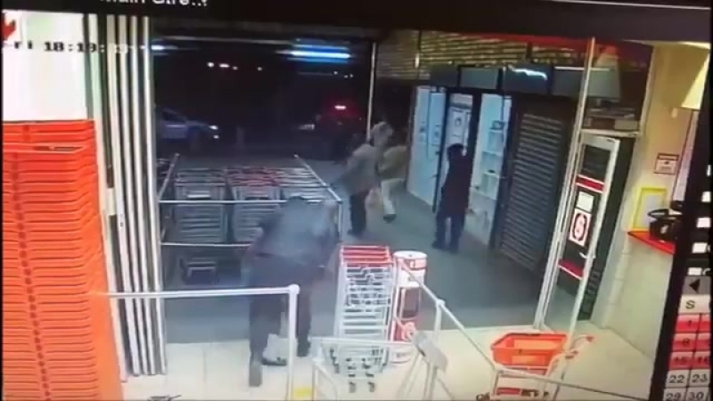 South Africa a security guard in a supermarket tries to arrest an armed robber, what the security guard did