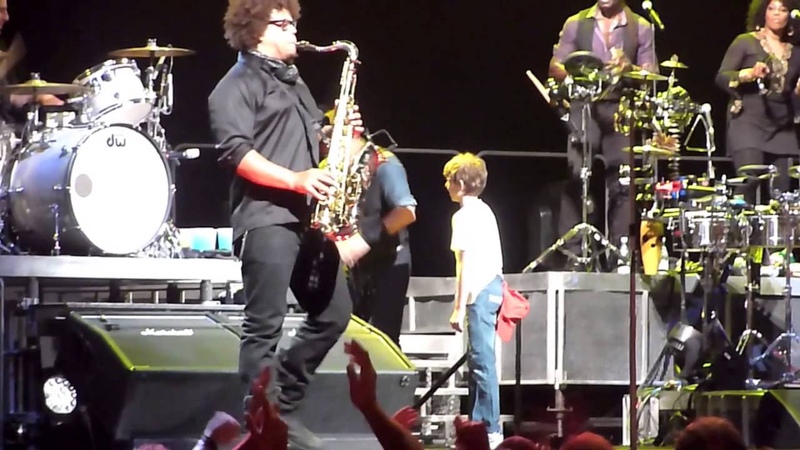 Bruce Springsteen with Eleven Year Old Boy on stage,